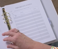 Close-up of My Health Journal open to the Important Dates tracking page, held in hand
